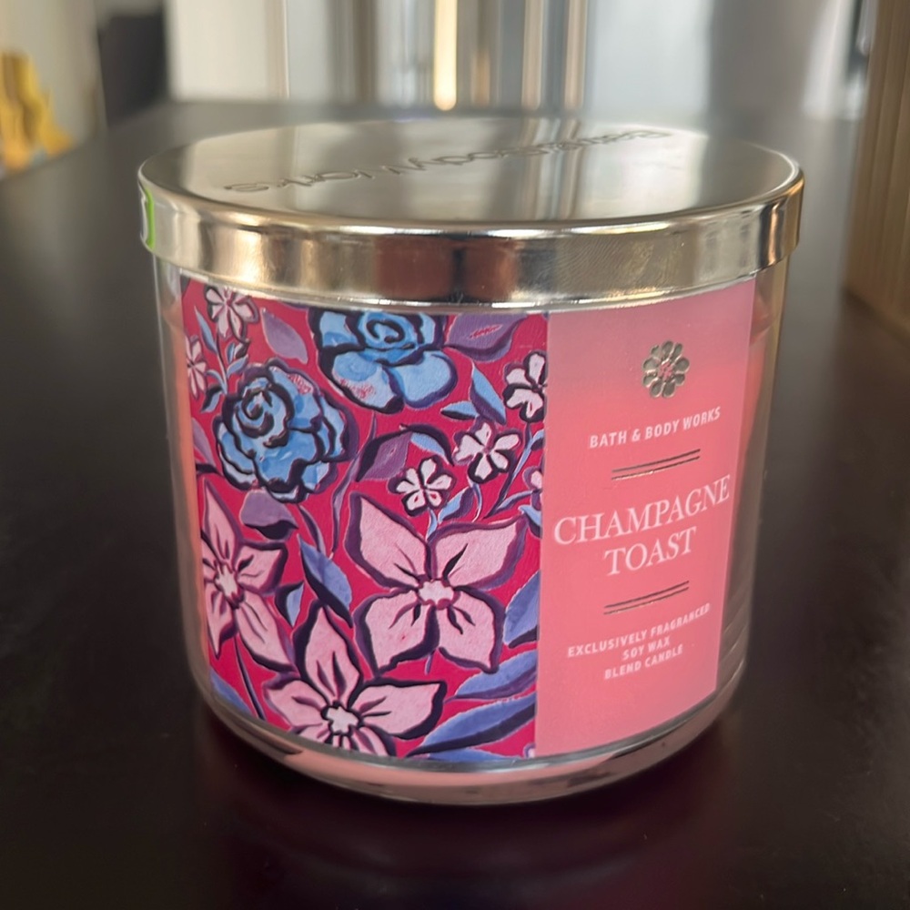 Bath & Body Works Champagne Toast 3-Wick Candle and gold candle holder